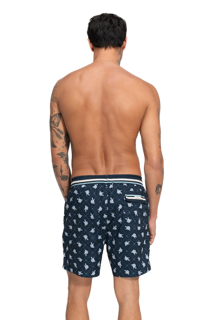 Navy swim trunks with light blue scattered print pattern, back view with striped waistband and side pocket