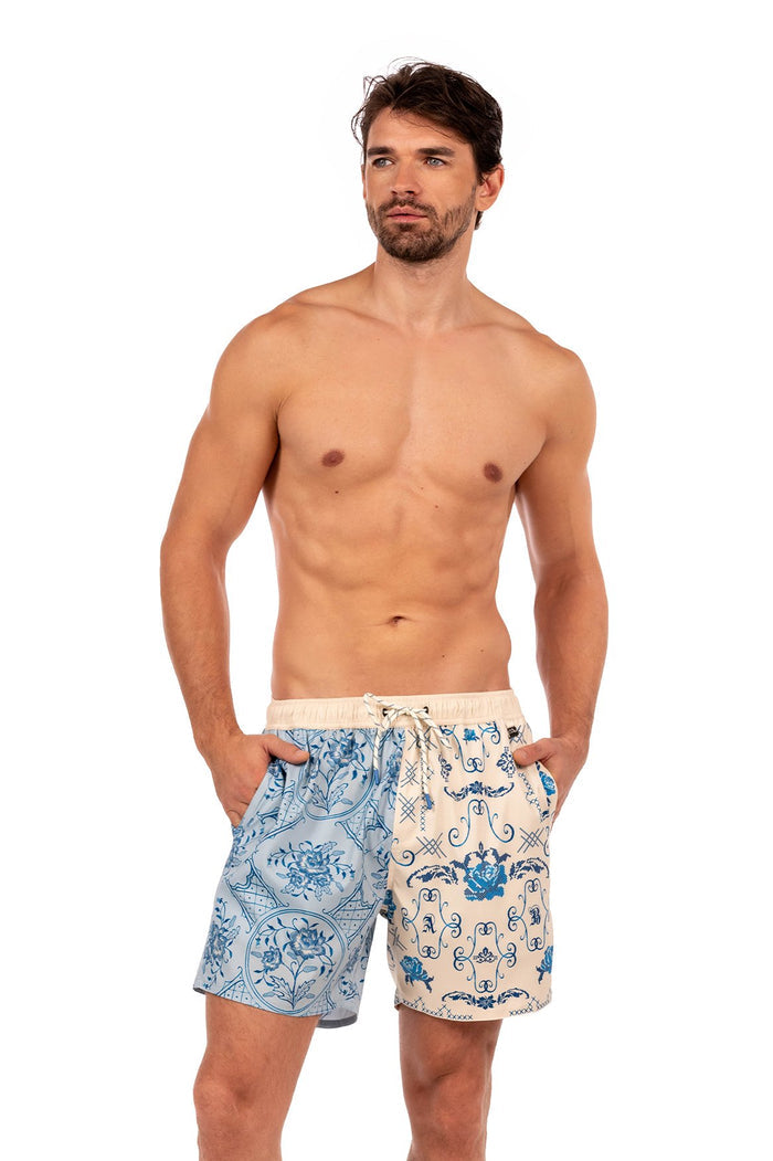 Joe Mens Trunks with split-leg design: left side light blue with circular pattern detail medallion print, right side cream with blue scrollwork patte…