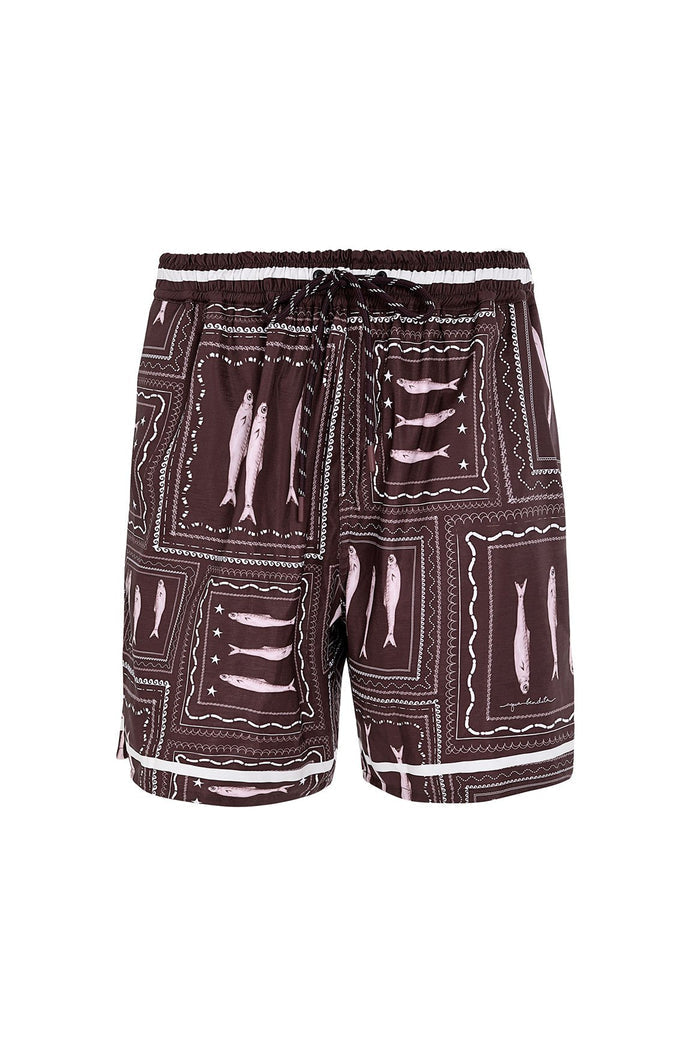 Brown trunks with white contrast piping and geometric patchwork print featuring rectangular frames with decorative stitching details
