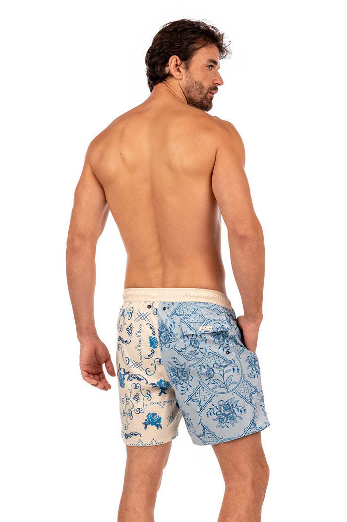 Joe men's swim trunks in cream and light blue with placement print featuring ornamental tile patterns and scrollwork details, back view