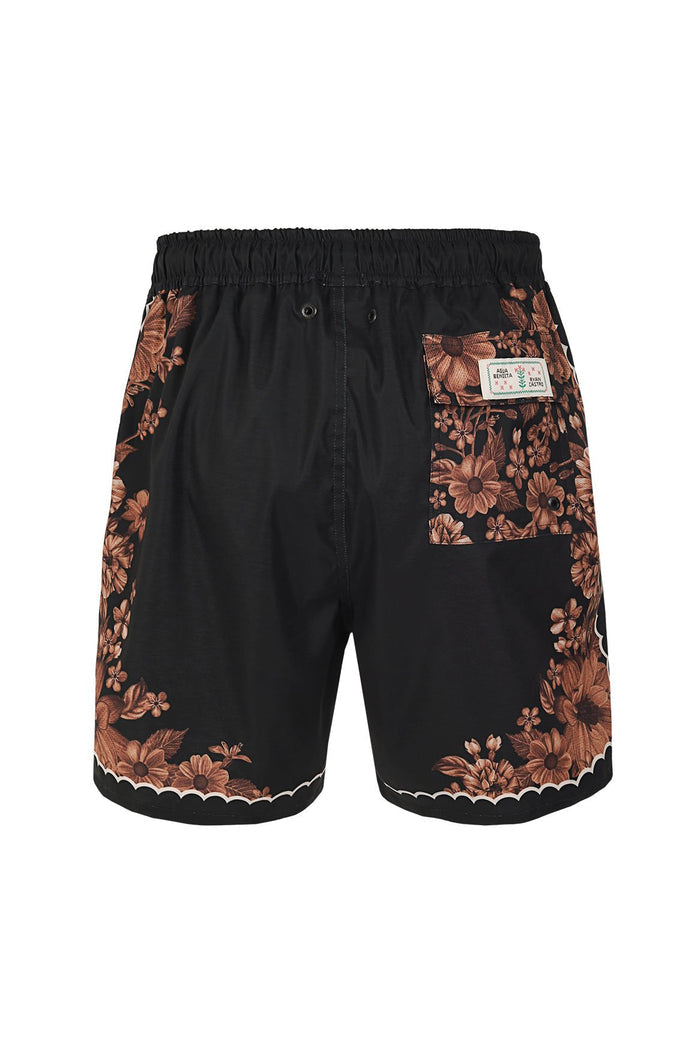 Black swim trunks with coral pattern detail embroidered print along sides and scalloped hem trim, back view