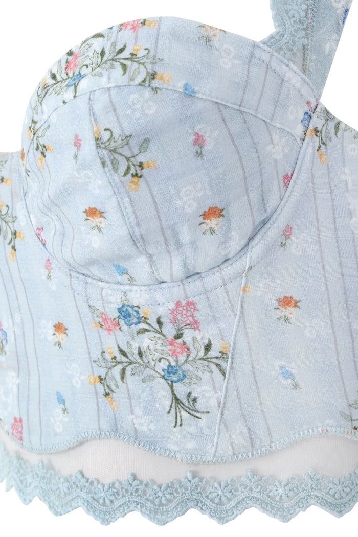 Light blue crop top with embroidered pattern detail vines, structured underwire cups, and scalloped lace trim detail