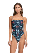 Kali one-piece swimsuit in navy with light blue symmetrical print and red pattern detail clusters, braided adjustable straps
