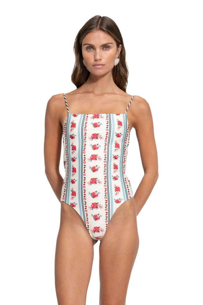 Kali one-piece swimsuit in ivory with vertical stripes of pink pattern detail clusters and blue lines, square neckline and braided straps