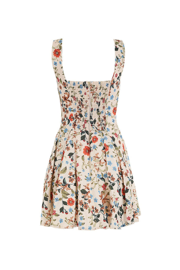 Kristen Dress in cream with multicolor floral print, structured bodice with smocked detail, wide straps, and flared skirt