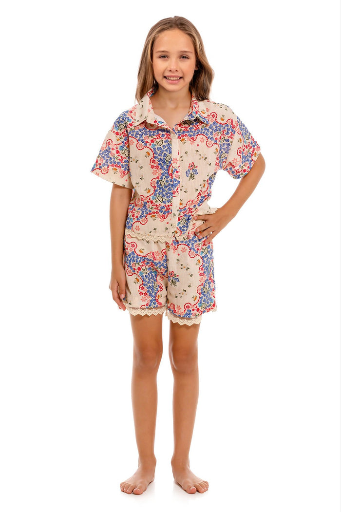 Laya Kids Shorts in cream with blue and coral pattern detail print, lace trim hem, elastic waist and side pockets