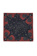 Lexi Scarf in rust and black with dotted western-inspired print featuring roses, stars, and decorative arrows along the border