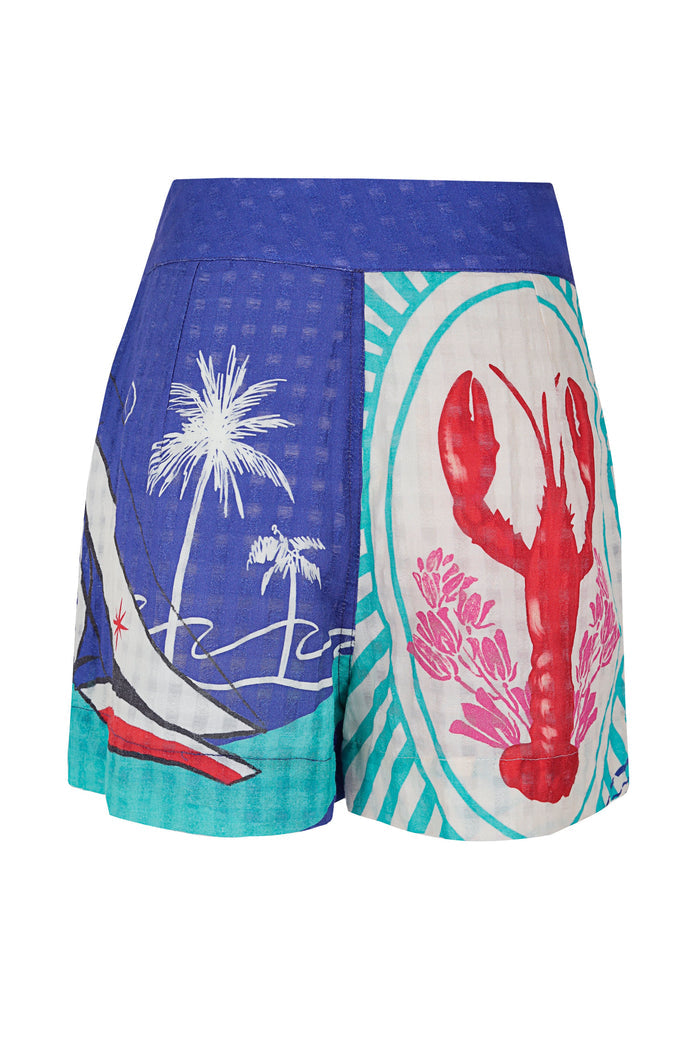 Lia shorts in blue and turquoise with placement print featuring white palm trees and red lobster silhouettes on colorful panels