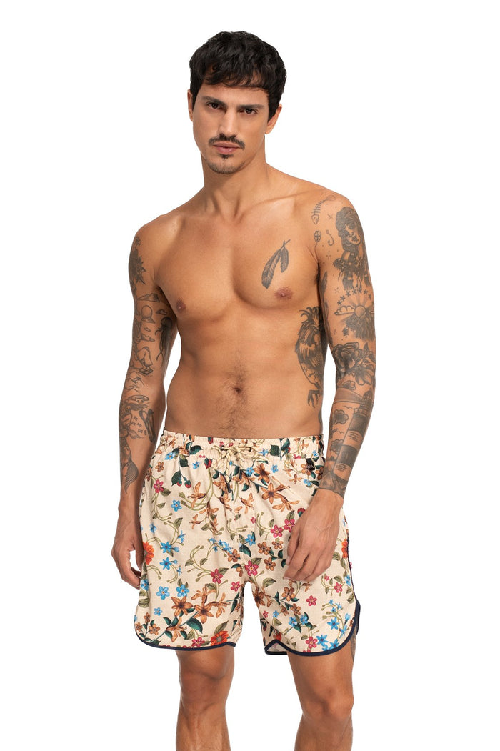 Liam men's swim trunks in cream with multicolor floral print and black trim