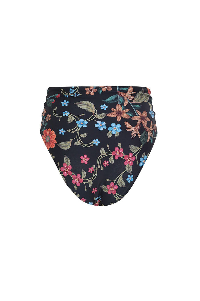 Black high-rise bikini bottom with colorful floral embroidery featuring pink, blue, and coral blossoms with green leaves and ruched side details