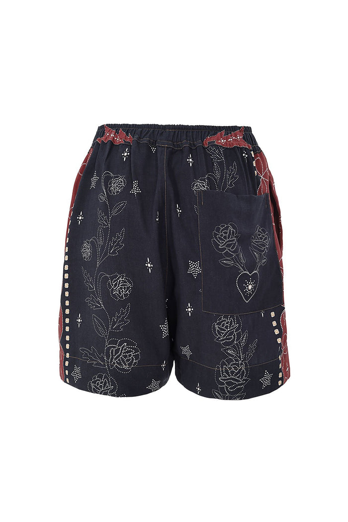 Linny Shorts in navy with white embroidered pattern detail pattern and terracotta side panels with geometric trim