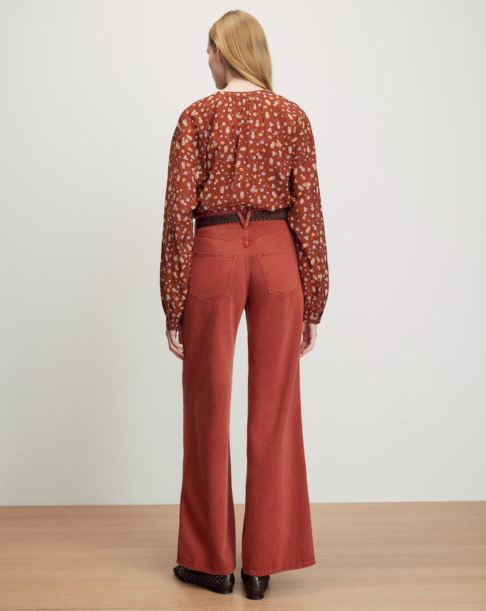 Veronica Beard Rust wide-leg jeans and a brown patterned long-sleeve
