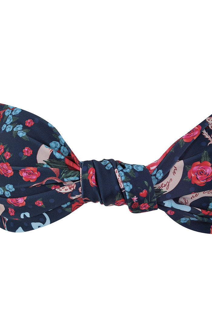 Navy bikini top with knotted center, pattern detail print featuring red roses, blue flowers, and green foliage