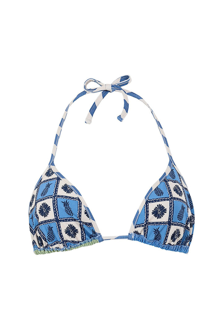 Blue and white triangle bikini top with checkerboard print of pineapples and sunburst shapes, halter tie straps with diagonal stripe pattern