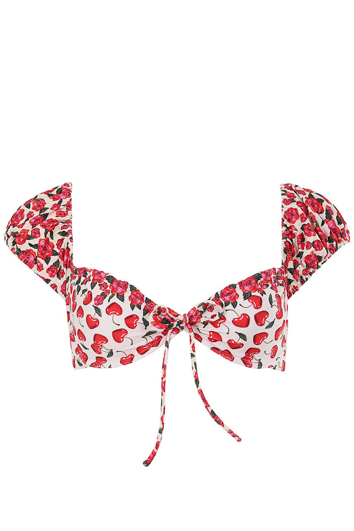 White bikini top with ruffle cap sleeves, red rose print and heart pattern, center tie front detail
