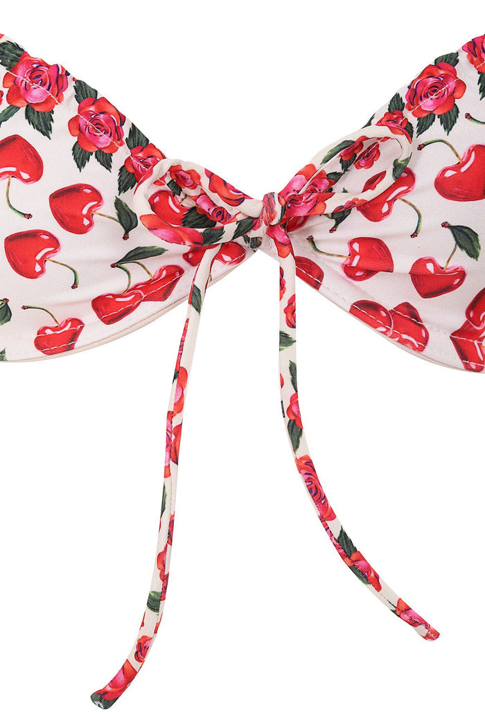White bikini top with red heart-shaped cherries and pink roses print, featuring center tie detail