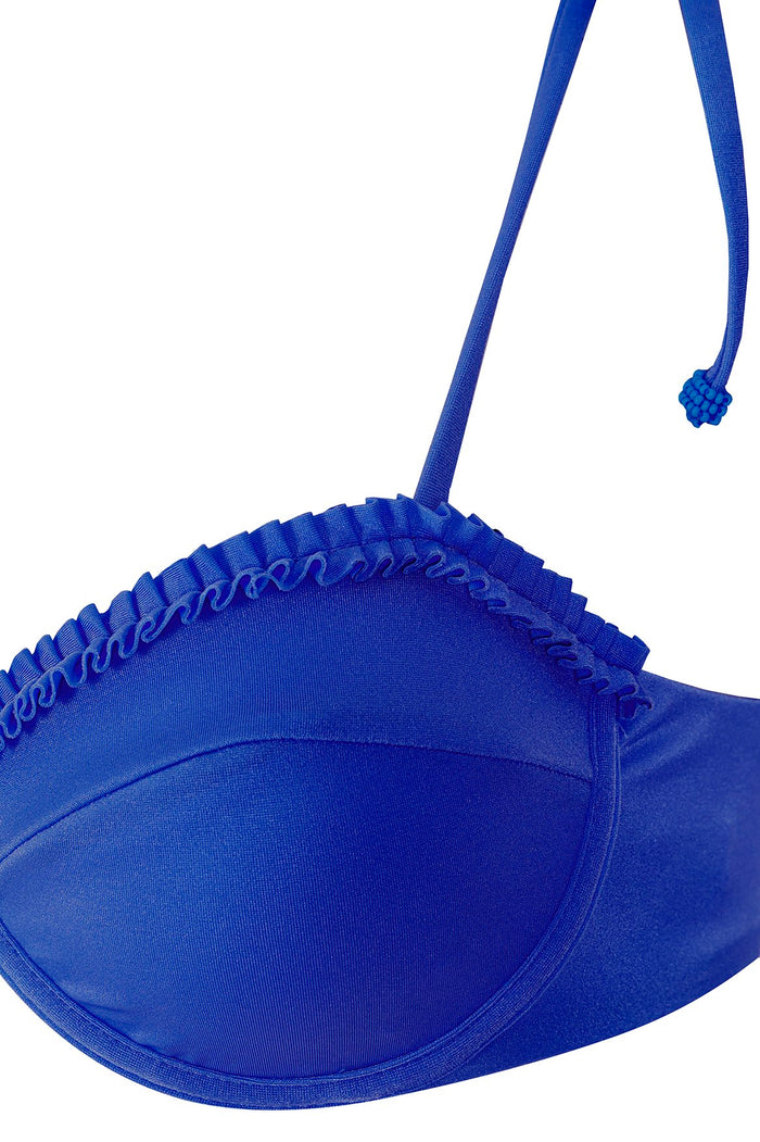 Blue bikini top with underwire cups, adjustable straps, knotted tie-ends, and ruffle trim detailing