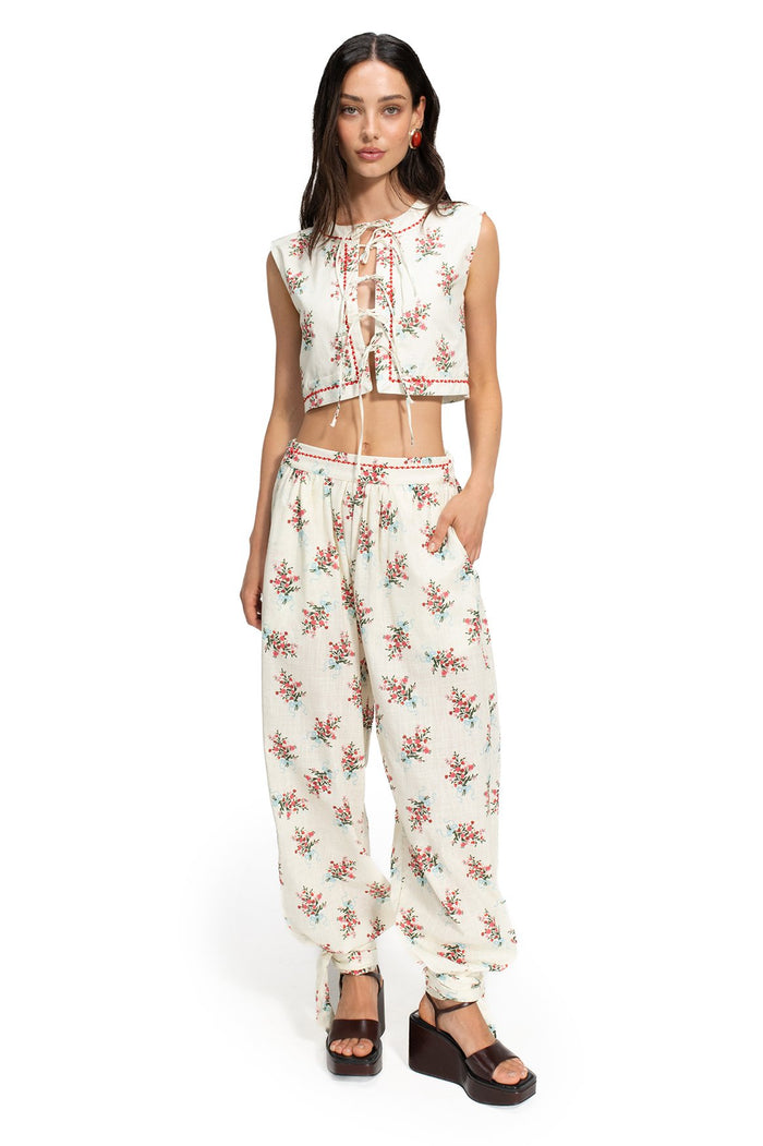 Madison Vest in cream with scattered floral print, featuring tie-bow front closure and matching wide-leg pants with red embroidered trim