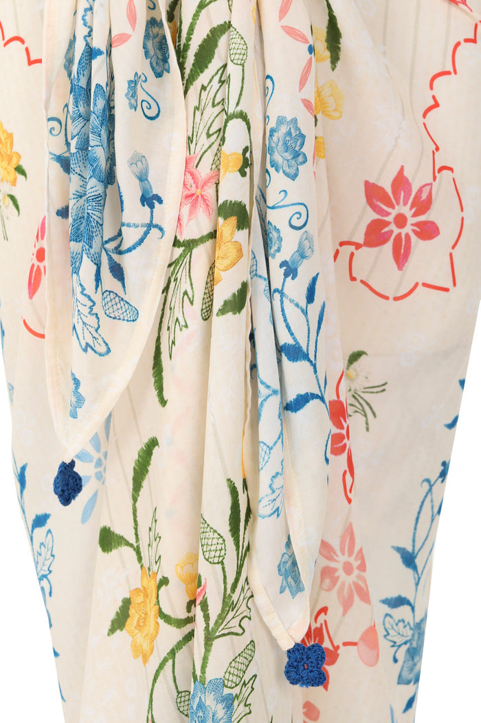 Ivory pareo with multicolor embroidered pattern detail print in blue, coral, yellow, and green, featuring handmade crochet detail