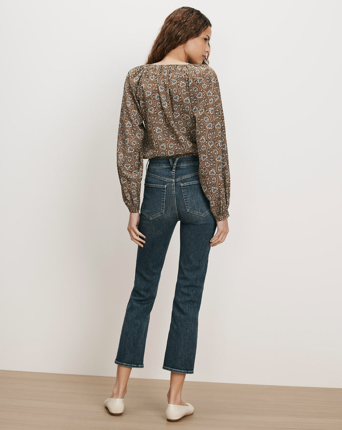Veronica Beard Brown floral peasant blouse, dark wash flare jeans.
