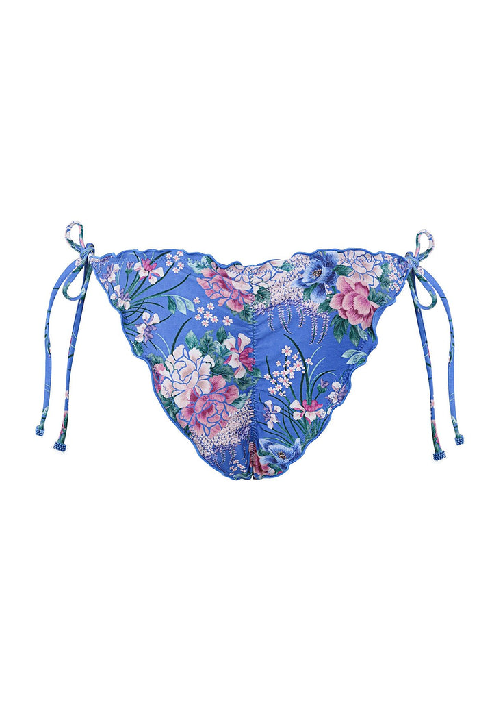 Blue bikini bottom with side ties and scalloped edges, featuring pink and white pattern detail print with green foliage