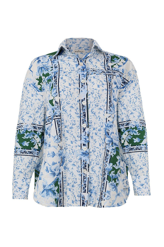 White collared shirt with blue pattern detail print and green botanical panels framed by navy piping