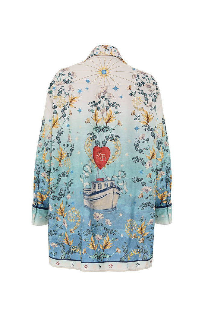 Nader Anastasia Shirt in ombre blue to cream with botanical print, ship illustration, red heart emblem, and starburst details on back