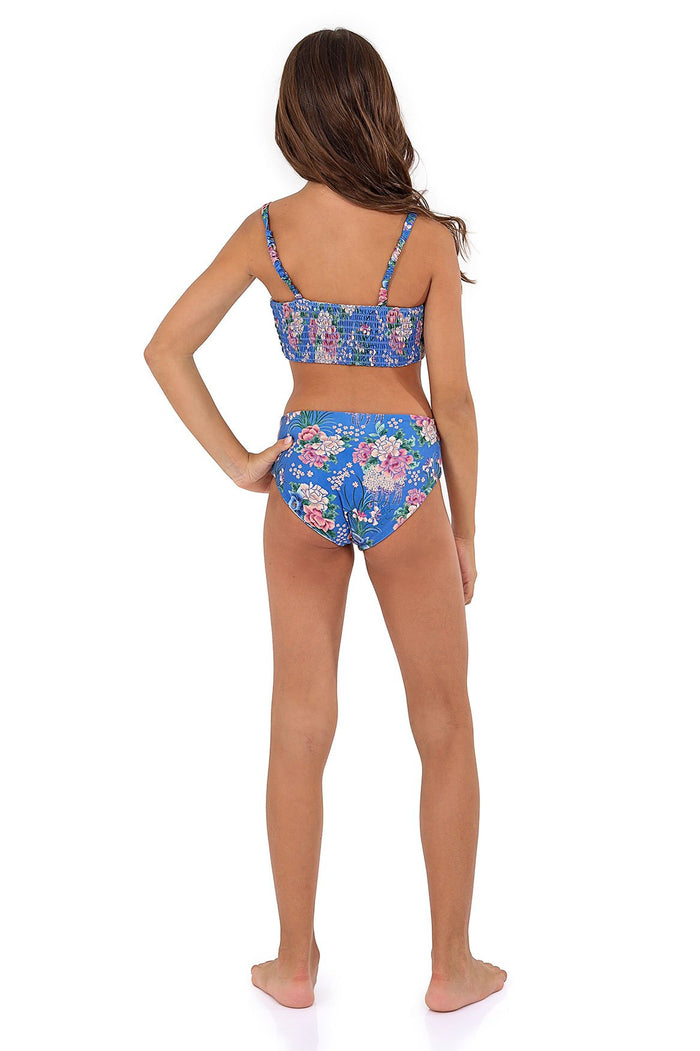 Blue two-piece bikini set with pattern detail print featuring pink blooms and botanical details, back view with smocked top and adjustable straps