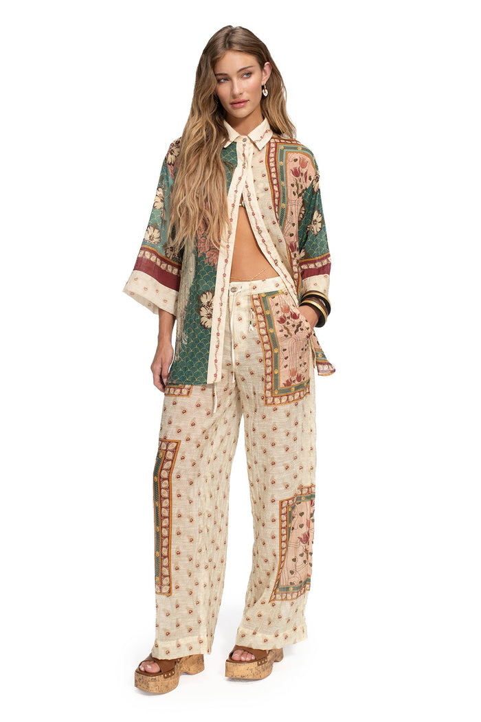 Nader Chrissy button-up shirt with 3/4 sleeves in cream base featuring teal lattice panels, coral pattern detail embroidery, and patchwork borders in…