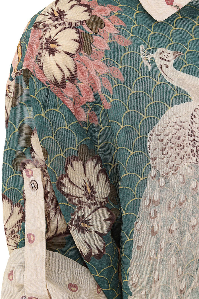 Button-up shirt with teal scalloped pattern, cream pattern detail blooms, pink ribbons, and mixed placement print panels