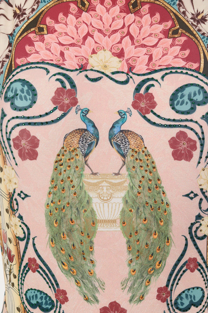 Nader Domenica one piece swimsuit in blush pink with ornate peacock and pattern detail print, rhinestone embellishments, high neckline and open back