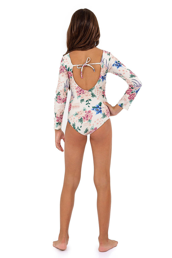 Long sleeve one piece swimsuit in cream with pink and blue pattern detail print, featuring open back with adjustable tie closure