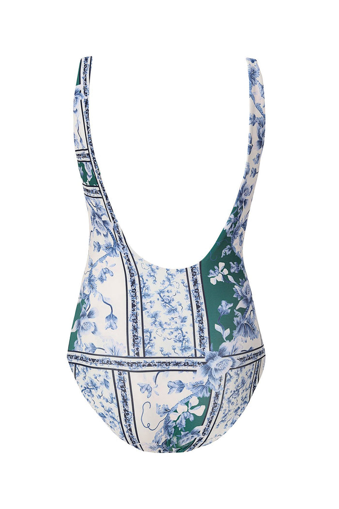 One-piece swimsuit with blue pattern detail print on cream and green tile-patterned panels, scoop neckline and back