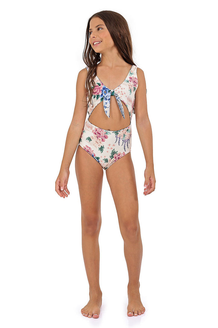 Girls' one-piece swimsuit with front tie cutout in cream base with pink, blue and teal pattern detail print