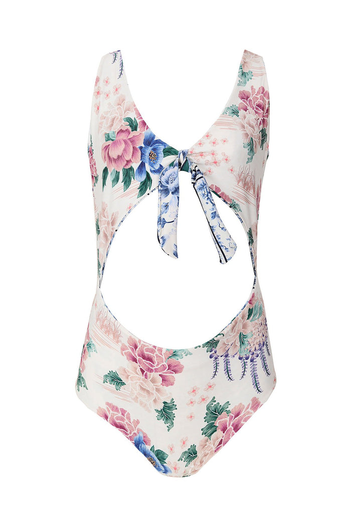 White one-piece swimsuit with pink, blue and green pattern detail print, front cutout and tie detail