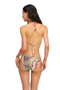 Nader Ilu bikini bottom in beige with reversible peacock-inspired placement print featuring curved scalloped patterns and pattern detail medallions i…