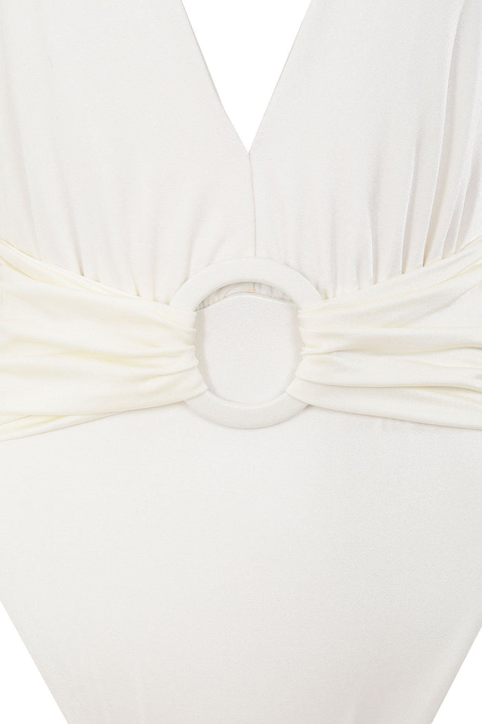 White one-piece swimsuit with deep V-neck and gathered waist detail featuring a circular ring accent
