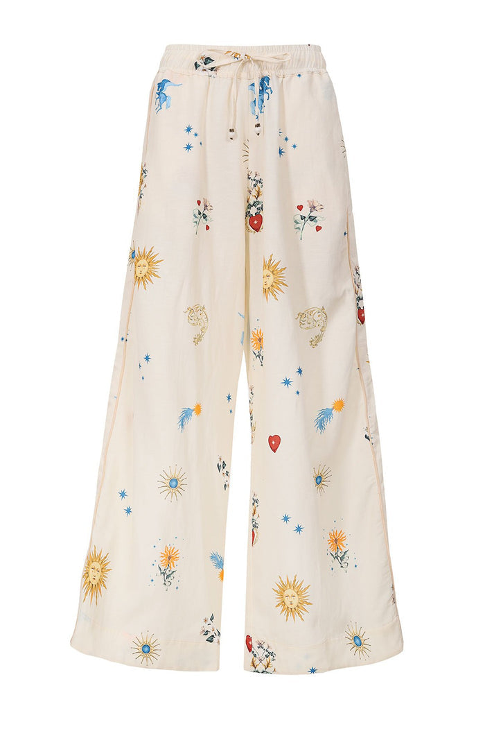 Cream wide-leg pants with scattered sun, star, heart and pattern detail print details, drawstring waist with beaded ties