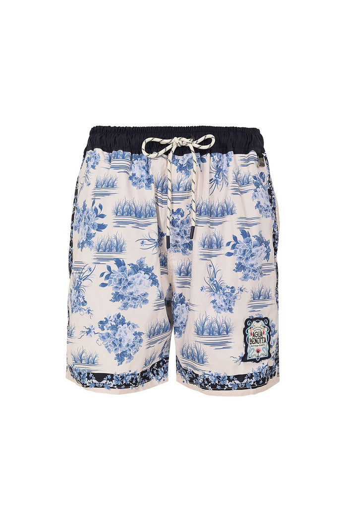 Men's swim trunks in cream with blue pattern detail print, waves, and foliage pattern, black contrast waistband and hem trim, rope drawstring