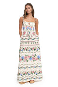 Nader Julia maxi dress in cream with horizontal floral print borders, structured bodice with scalloped cut-out details, and adjustable straps