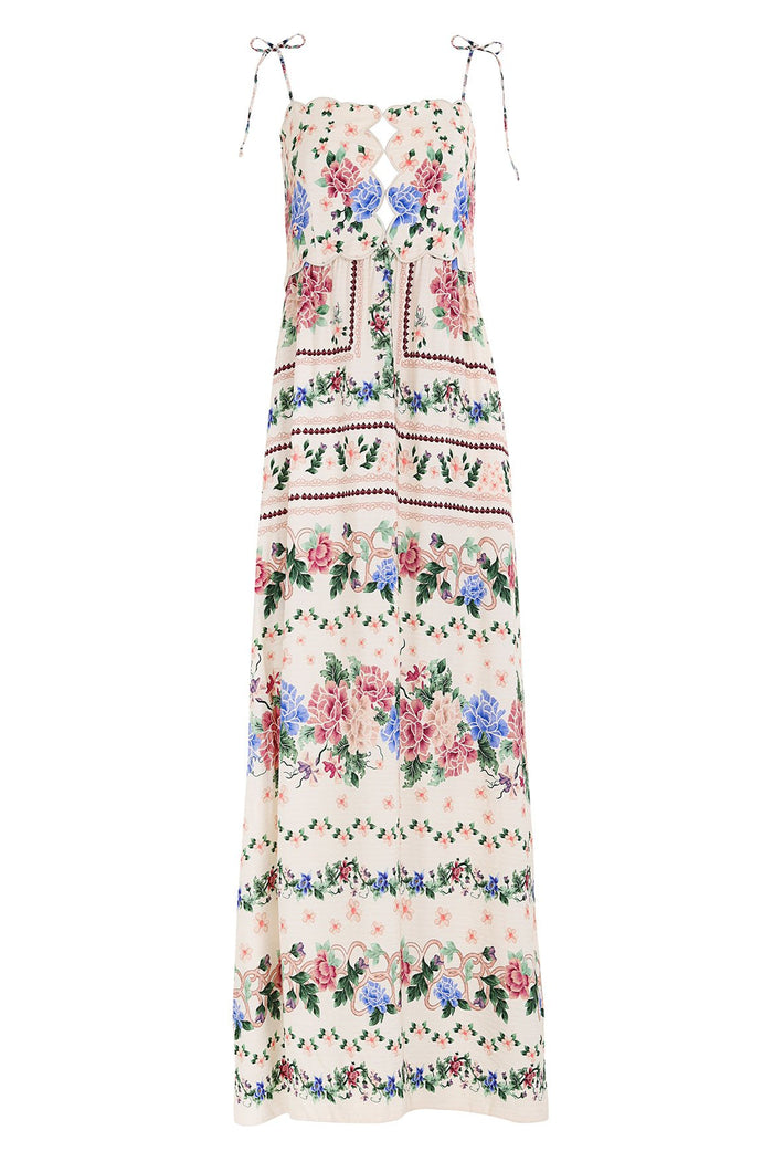 Nader Julia Dress in cream with horizontal floral borders in pink, blue and green, featuring adjustable shoulder ties and scalloped bodice cutout