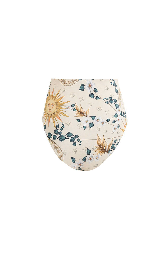High-waist bikini bottom in cream with celestial print featuring suns, moons, stars, and botanical vines in gold and teal tones