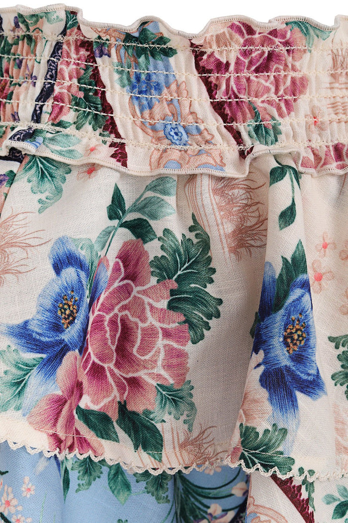 Nader Kavi Kids' Skirt with elastic waist, tiered ruffle layers, and cream base featuring blue and pink pattern detail print with green foliage