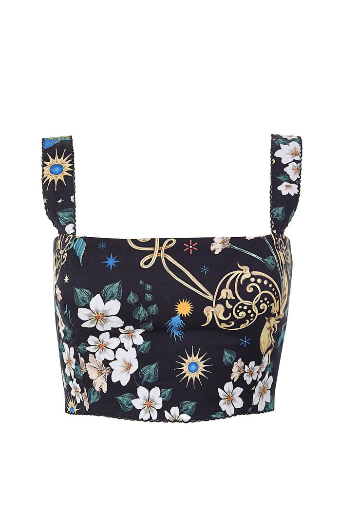 Black crop top with white pattern detail print, celestial suns, stars, and decorative scroll details with ruffled straps