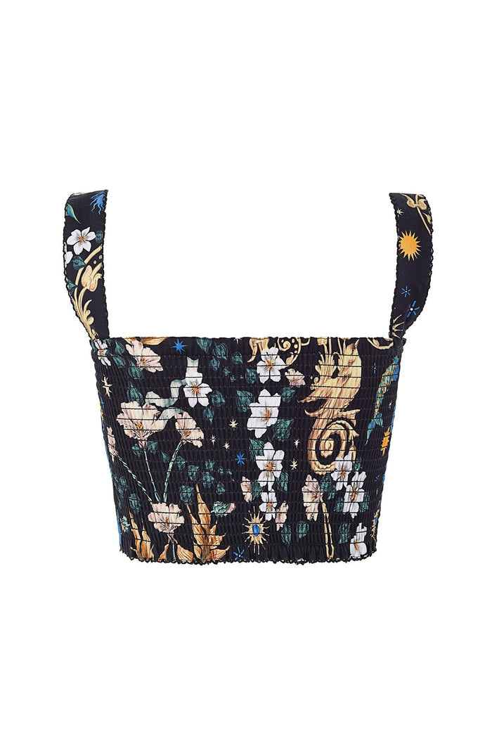 Black ribbed crop top with square neckline and wide straps featuring pattern detail print with white blooms, teal leaves, and golden sun accents