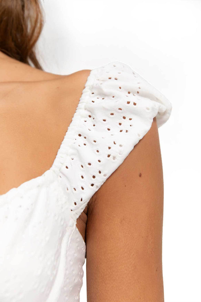 White eyelet bikini top with scalloped ruffle sleeves and front tie closure