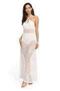 White crochet maxi dress with halter neckline and open-knit geometric pattern throughout