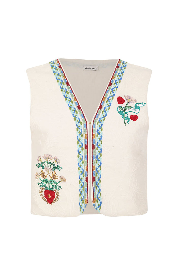 Nader Mabel Vest in cream with embroidered pattern detail details, red heart accents, and multicolored chevron trim along the v-neck placket