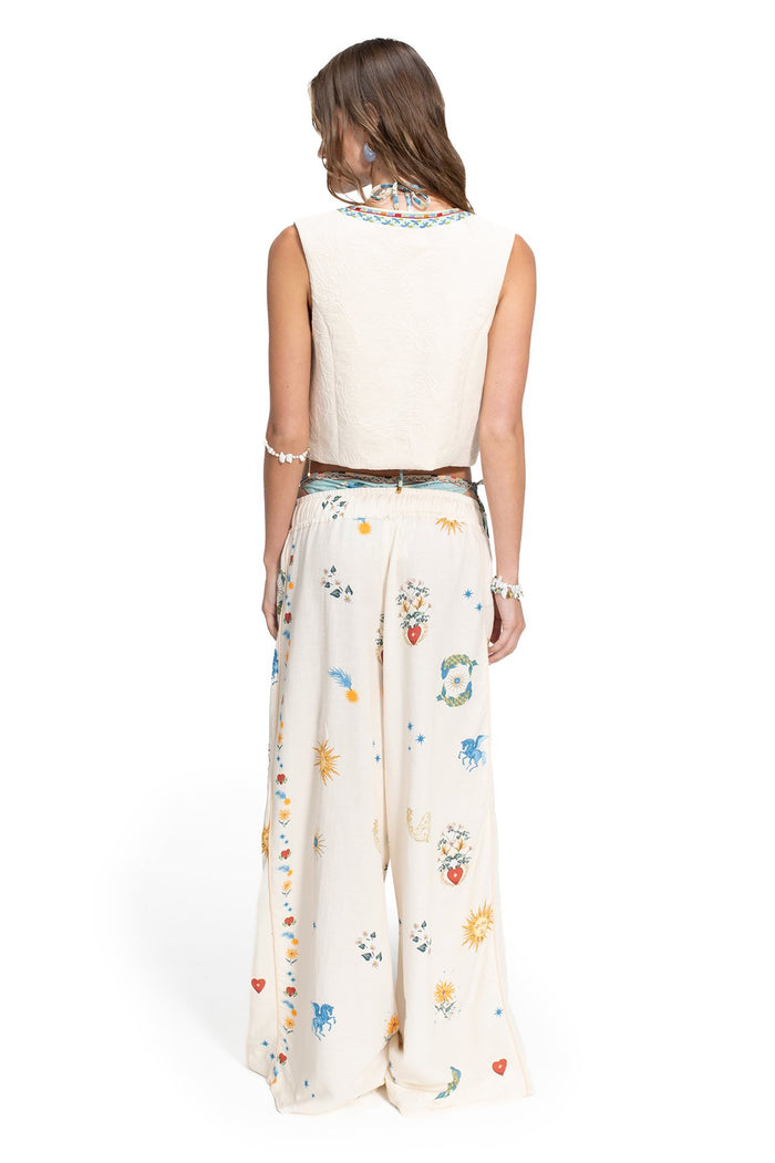 Cream textured vest with embroidered neckline trim, shown back view paired with wide-leg pants featuring scattered embroidered sun, heart, and patter…