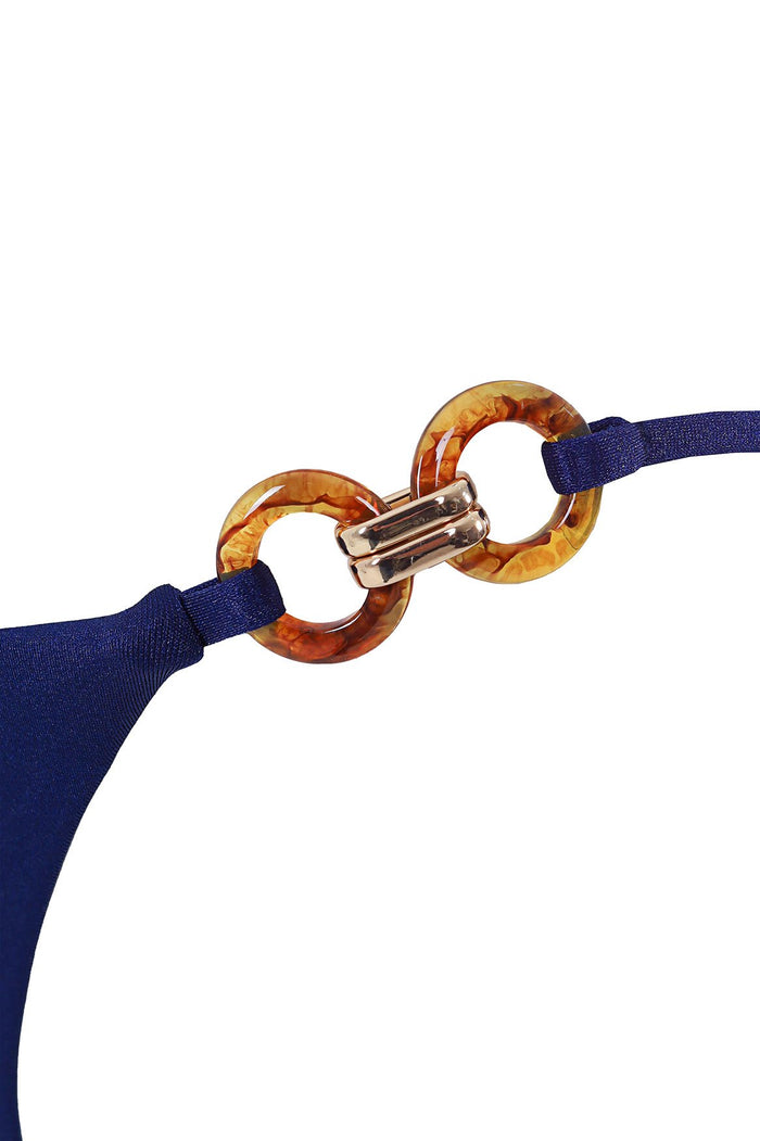 Navy bikini bottom with tortoiseshell ring hardware detail at hips